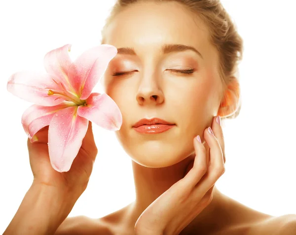 Beauty face of the young woman with pink lily — Stock Photo, Image