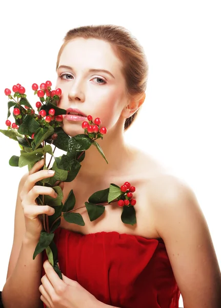 Beautiful woman with red flowers — Stock Photo, Image