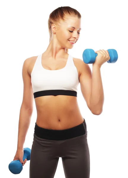Vrouw in sportuitrusting oefenen met handgewichten — Stockfoto