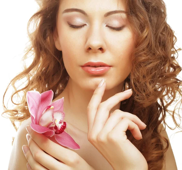 Mulher com orquídea rosa — Fotografia de Stock