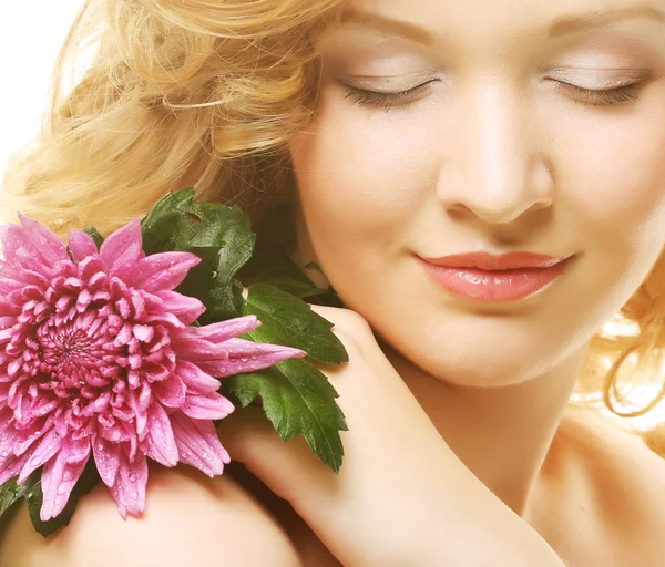 Woman with  pink flower — Stock Photo, Image