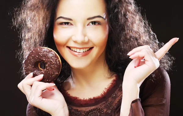 Woman holding a donut — Stock Photo, Image