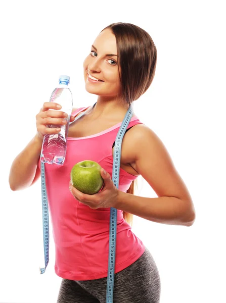 Gezonde vrouw met water en appel dieet glimlachen — Stockfoto