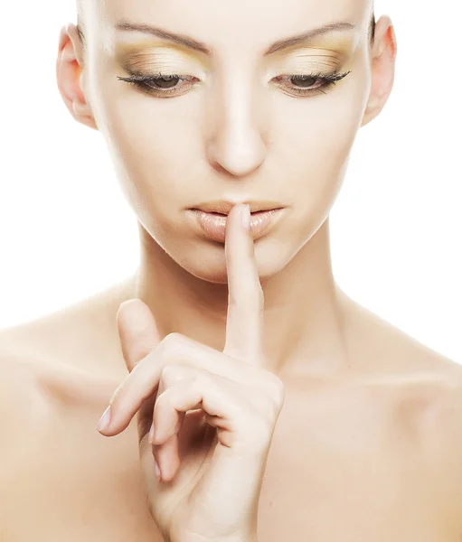 Girl with finger over her mouth — Stock Photo, Image