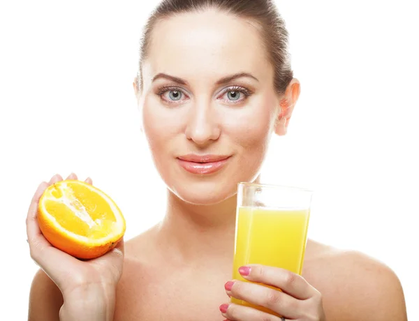 Young happy woman drinking orange juice. — Stock Photo, Image