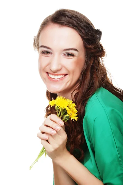 Beautiful young woman with big yellow dandelions — Stock Photo, Image