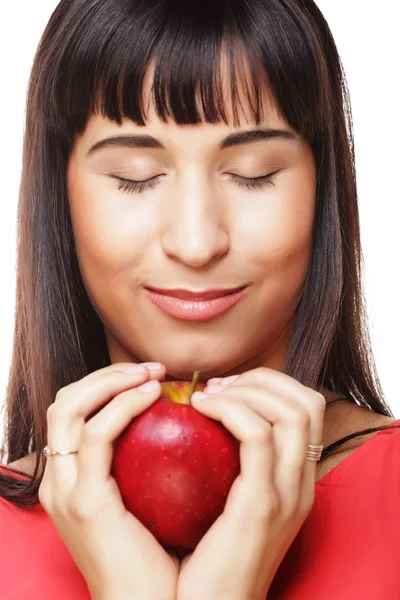 Schöne brünette Frau mit rotem Apfel in den Händen — Stockfoto