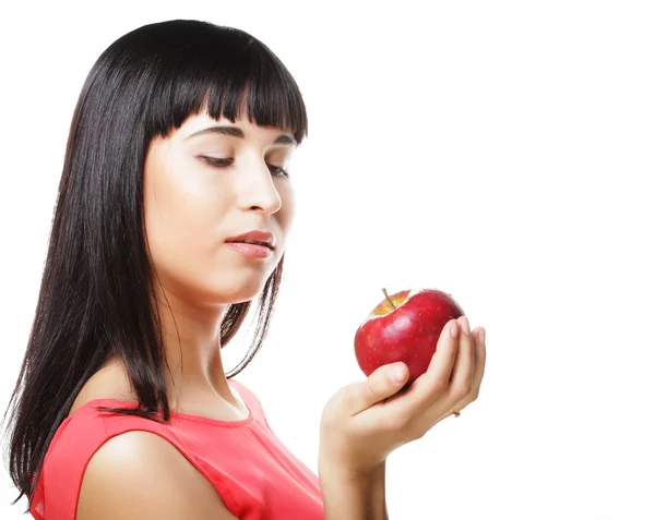 Beautiful brunette woman with red apple in hands Stock Image