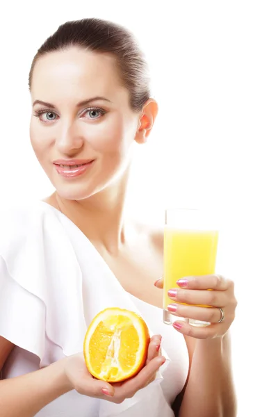 Young happy woman drinking orange juice. — Stock Photo, Image