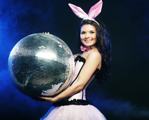 Sexy bunny-girl with disco ball — Stock Photo, Image