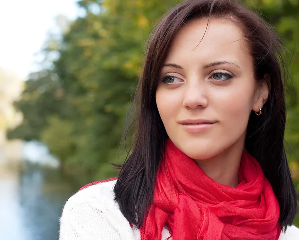 Happy woman  near the river in autumn season — Stock Photo, Image