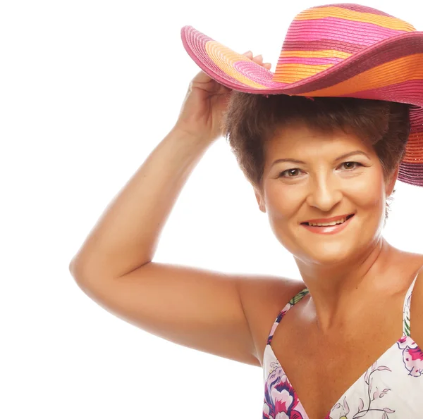 Mature happy woman with pink hat — Stock Photo, Image