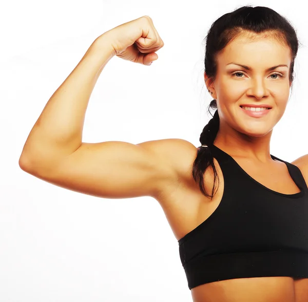 Jong sportief vrouw flexing haar biceps — Stockfoto