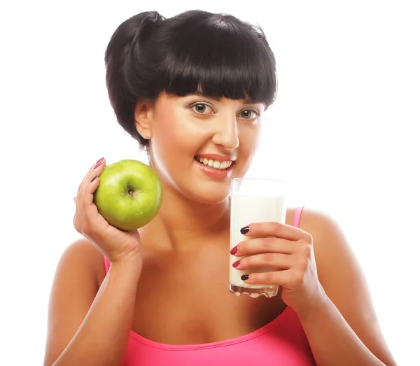 Woman with green apple and milk — Stock Photo, Image