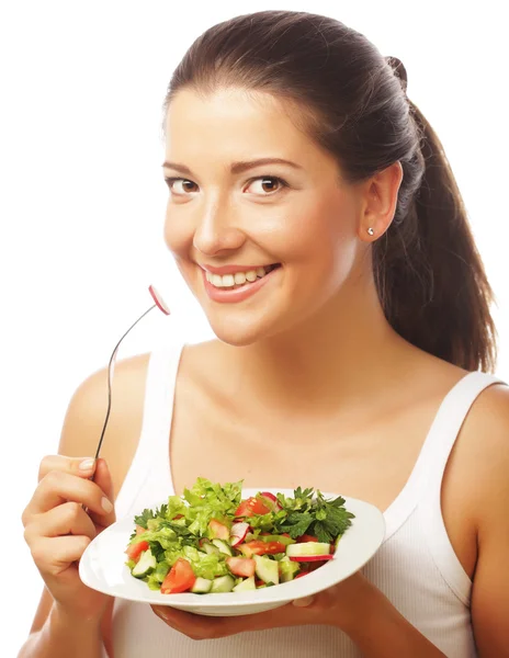 Mujer joven comiendo salat fresco — Foto de Stock