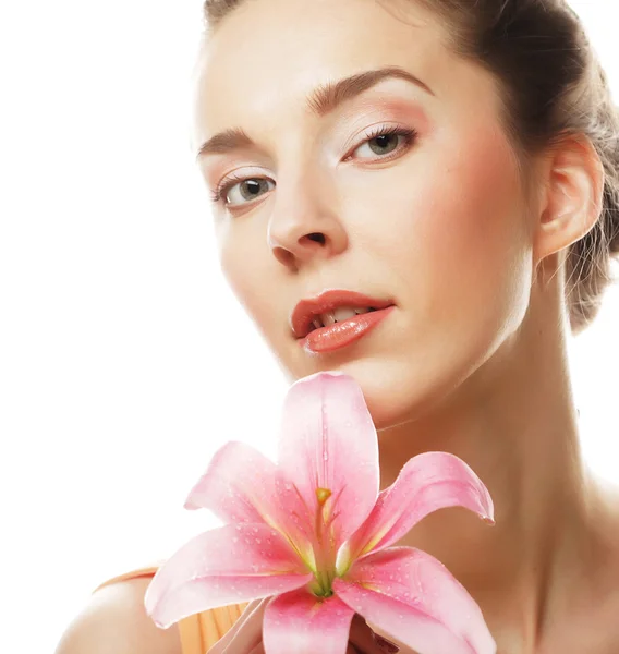 Beauty face of the young woman with pink lily — Stock Photo, Image