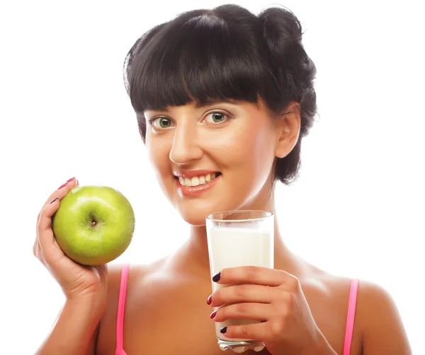 Woman with green apple and milk — Stock Photo, Image