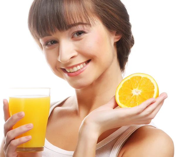 Young happy woman drinking orange juice. — Stock Photo, Image