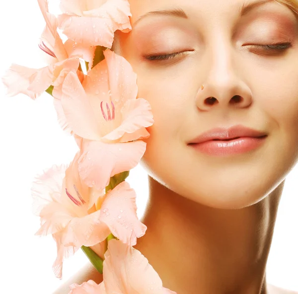 Fresh face with gladiolus flowers in her hands — Stock Photo, Image