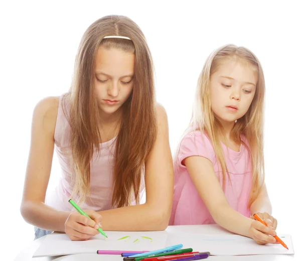 Sisters draw on the album — Stock Photo, Image