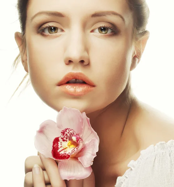 Beautiful woman with pink flower — Stock Photo, Image