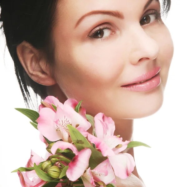 Donna con fiori rosa — Foto Stock