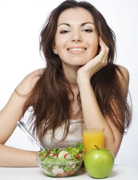 Young woman has breakfast salad — Stock Photo, Image