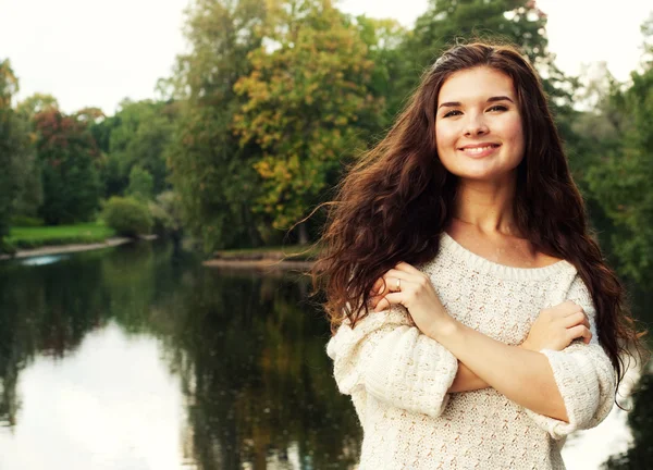 Woman  near the river in autumn season — Stock Photo, Image