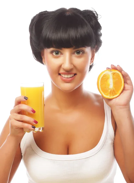 Young happy woman drinking orange juice — Stock Photo, Image