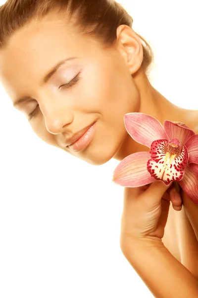 Girl holding orchid flower in her hands — Stock Photo, Image