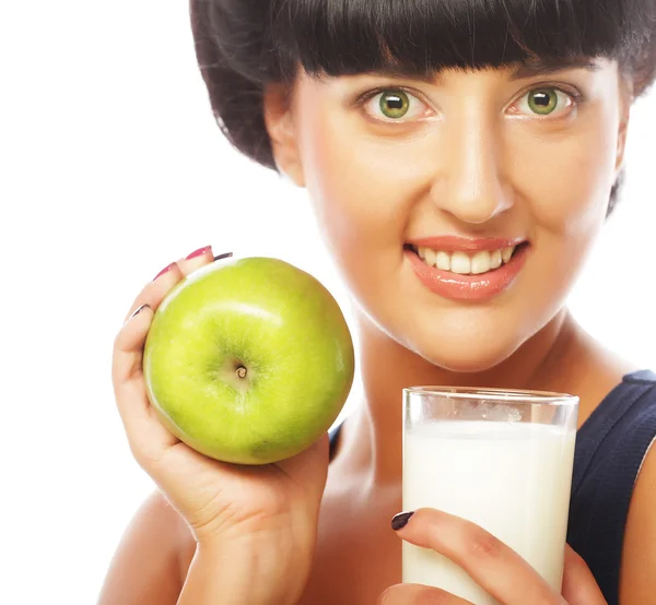 Woman with apple and milk — Stock Photo, Image