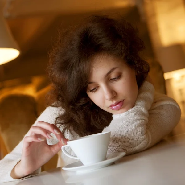Beautiful woman with a white cup — Stock Photo, Image