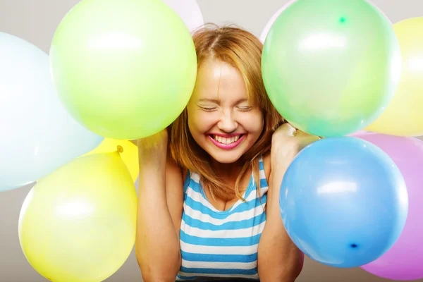 Menina feliz com balões — Fotografia de Stock