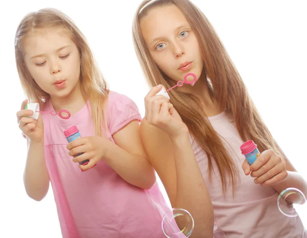 Girls with soap bubbles Stock Picture