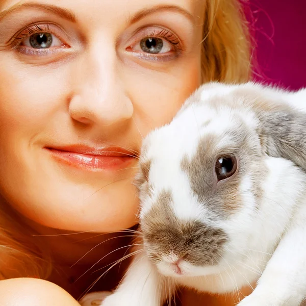 Portrait girl holding rabbit on hand — Stock Photo, Image