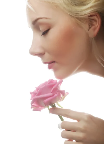 Young woman with pink rose — Stock Photo, Image