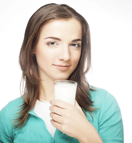 Young lady having a glass of milk Royalty Free Stock Images