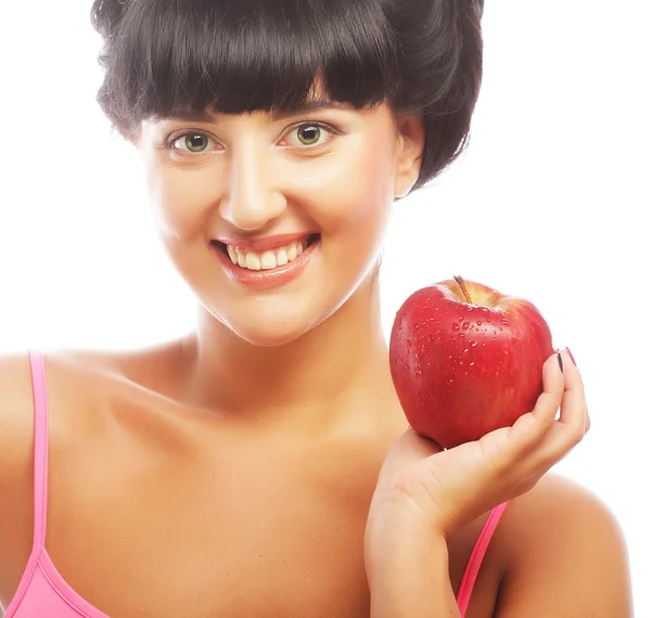 Junge brünette Frau mit rotem Apfel — Stockfoto