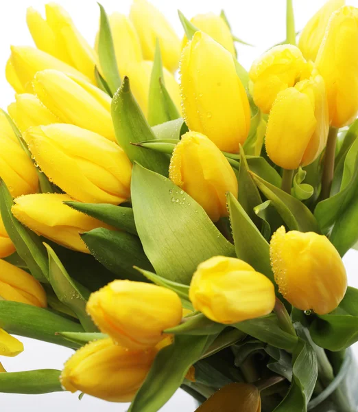 Ramo de tulipanes en jarrón de vidrio — Foto de Stock