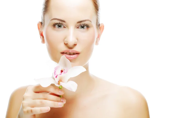 Mulher com flor de orquídea — Fotografia de Stock