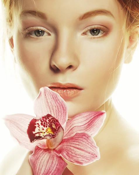 Beautiful woman with pink flower — Stock Photo, Image