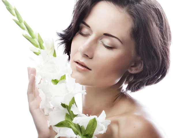 Woman with gladiolus flowers — Stock Photo, Image