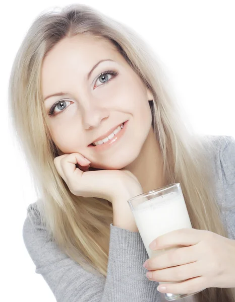 Young woman holding a glass of fresh milk Royalty Free Stock Photos