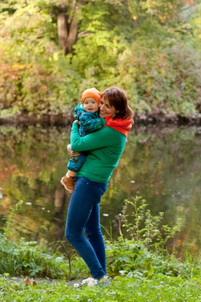 Happy family having fun in autumn park — Stock Photo, Image