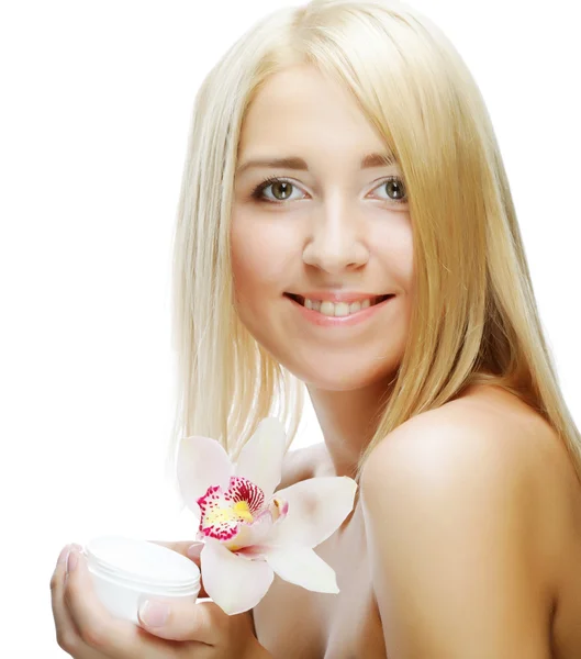 Beautiful woman with pink flower — Stock Photo, Image