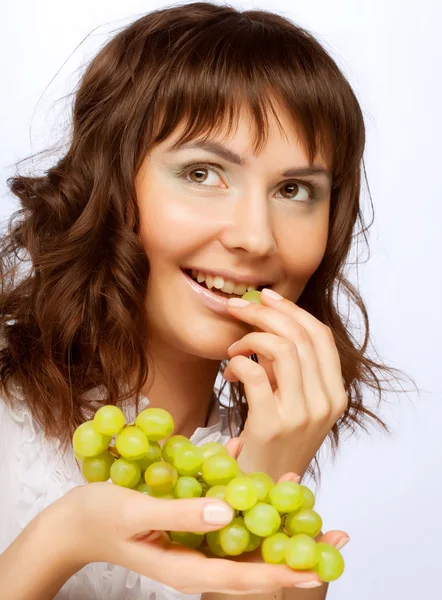 Woman with green grapes — Stock Photo, Image