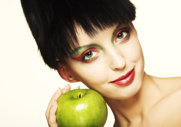 Aranyos nő gazdaság zöld alma — Stock Fotó