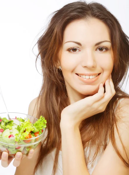 Woman has breakfast salad from fresh vegetables — Stock Photo, Image