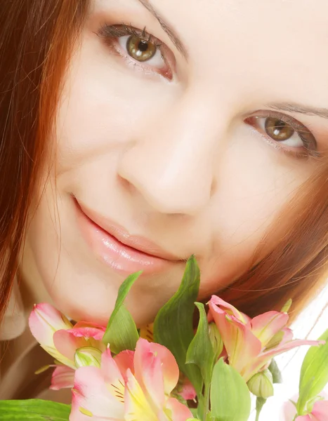 Beautiful woman with pink flower — Stock Photo, Image