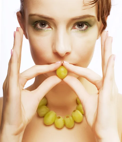 Woman with green grapes — Stock Photo, Image